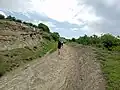 A road passing through a rocky outcrop in Tbilisi