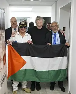 Waters with the Palestinian flag, alongside Colombian president Gustavo Petro, in New York
