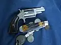 The .22 M- A .22 Winchester Magnum Rimfire revolver equipped with "Boot Grips".