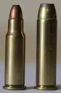 .256 Winchester Magnum round next to its parent case, the .357 Magnum.