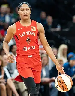 photograph of Colson dribbling a basketball while in a Las Vegas Aces uniform