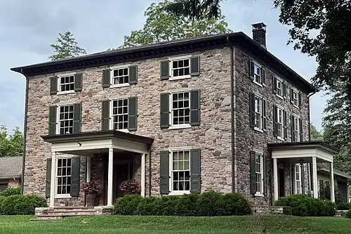 Historic stone house overlooking the river