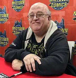 David sitting at a table