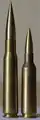 .50 BMG cartridge on the left and a .416 cartridge on the right.