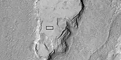 Enlarged view of a part of previous image, as seen by HiRISE under HiWish program. The rectangle represents the size of a football field.