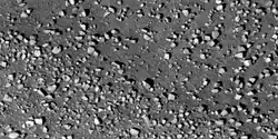 Close view of boulders along crater rim Boulders are roughly the size of cars or small houses. Picture taken with HiRISE under HiWish program.