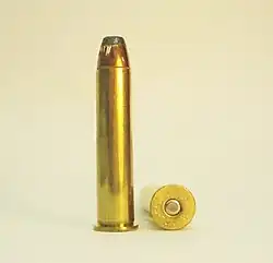Side view of a .45-70 Government cartridge showing the rimmed case profile and headstamp markings.