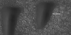 Boulder and boulder tracks, as seen by HiRISE under HiWish program The arrow shows a boulder that has made a track in the sand as it rolled down dune. Location is Mare Boreum quadrangle.