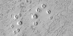 Close view of cones, as seen by HiRISE under HiWish program. These cones probably formed when hot lava flowed over ice-rich ground.