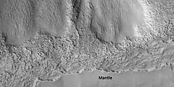 Close view that displays the thickness of the mantle, as seen by HiRISE under HiWish program Location is Ismenius Lacus quadrangle.