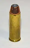 .45 Colt cartridge featuring a jacketed hollow point bullet
