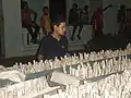 A kid stares at firework filled racks just ready for take off in Camajuani streets. Several blocks are filled with these.