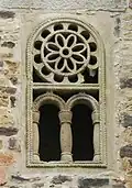 Window to the left above the portal