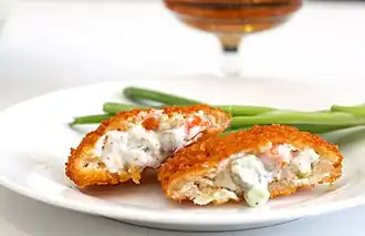 Corn and chicken coated in breadcrumbs and fried.