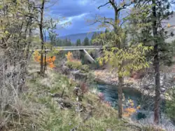 Charles Road crossing the Spokane River and connecting the west and east sides of the community