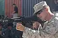 U.S. Marine Corps Cpl. Cory J. Becker, of Golf Company, 2nd Battalion, 7th Marine Regiment, shows Afghan National Police recruits different firing positions using an AMD-65 assault rifle on Lashkar Gah, Afghanistan, June 3, 2008.