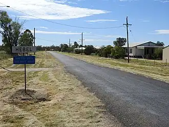 Entry sign to Hebel (2021).