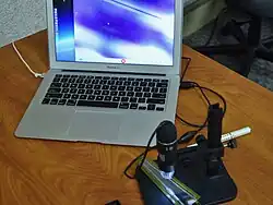 A Forward Silicon Vertex Detector (FVTX) sensor of PHENIX detector on a microscope[21]