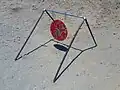 A swinging round steel target with suspension frame, popularly known as a "gong"