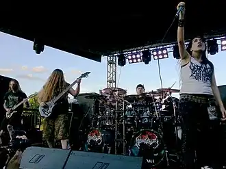 Image of band onstage in 2016