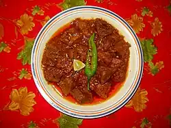 Achar gosht, a meat curry cooked with flavours from pickle