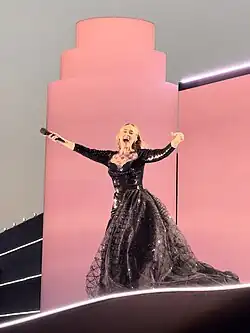 Adele performing in a custom black Armani Privé gown