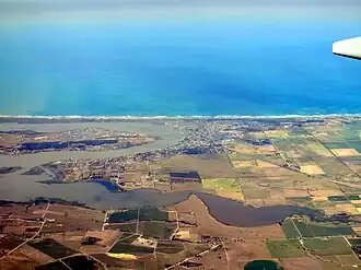 Goolwa South located on the oceanic coastline between the left-hand side of and the middle of the image.