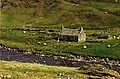 An aerial ropeslide spanning the river, approximately halfway along its course, provides a resident easy access to their cottage (2000)
