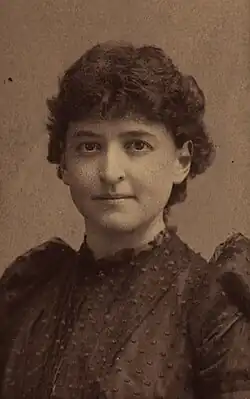 Portrait photograph of Agnes Inglis, wearing a black dress