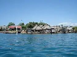 Photograph of houses next to water