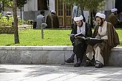 Two seminary students debating in the Fayziyeh School of Qom