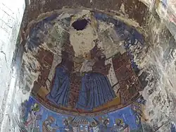 The badly damaged painting of the Holy Virgin holding Jesus