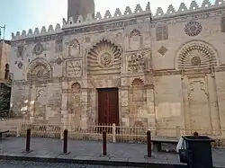 The street façade (the portion to the right of the entrance portal is a recent reconstruction)