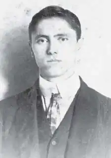 Black and white front-facing photo of Batson in a suit