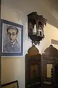 A room contains a posthumous portrait of Cavafy and portraits of friends.