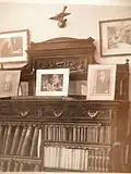 Library at Le Plantier with photographs of the Bourgets' bedroom and office in Paris, 1927.
