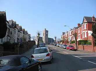 A typical street in Barry, All Saints Church pictured at the top of the hill