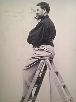 Mucha working on a poster for publishing house Cassan (1896)