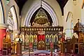 The present altar made from a former screen