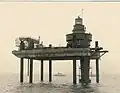 Fig. 7 Upper storeys are lifted onto the tower shaft from the offshore lift platform