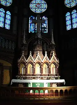 Skien Church's altar piece is shaped like a church facade with portals and towers and surrounded by stained glass windows