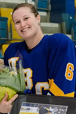 A portrait of Asay dressed in a blue jersey