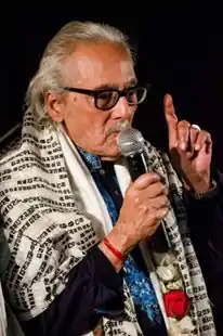 Chowdhury speaking at an award ceremony