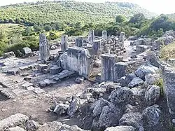 View over the remains of the Horvat Sumaqa synagogue with wooded hills stretching to the south