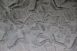Elbow to the jaw pass the arm shield. Bas-relief located at Angkor Wat (1100s)
