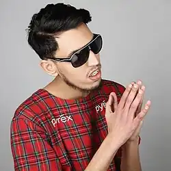 Anoghan posing for his single's art work "Walou"