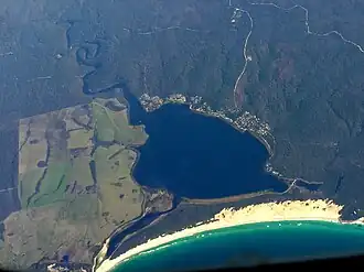 Aerial photo from the east; the village at the top of the bay