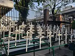 49 crosses with the names of the children killed during the fire.