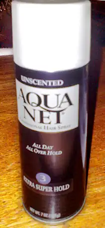A purple aerosol canister with a white cap
