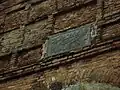 The Arabic inscription that reads: "Muhammad, the Arabian, is glory of both worlds. Dust be on the head of him who is not the dust of his portal"[5]